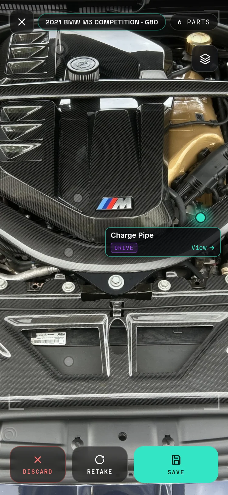 An engine bay scan, routed to cloud vision, tap a dot to get the part